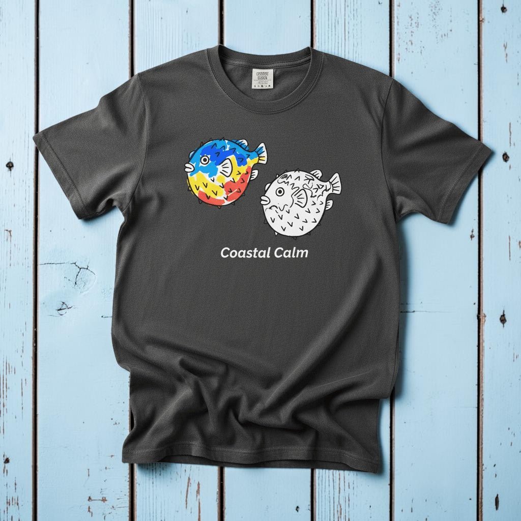 Puffer Fish Coastal Calm graphite garment-dyed tee on faded driftwood planks