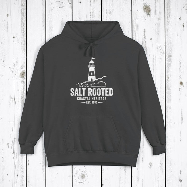 Pepper charcoal Salt Rooted lighthouse hoodie on sandy beige background — mobile product shot