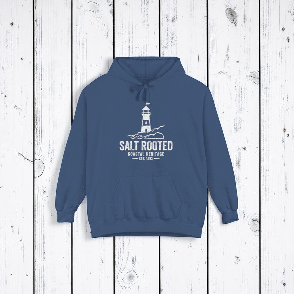 True Navy Salt Rooted lighthouse hoodie on sandy beige background — mobile product shot