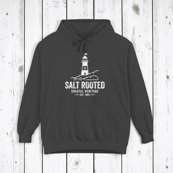 Pepper charcoal Salt Rooted lighthouse hoodie on sandy beige background — mobile product shot