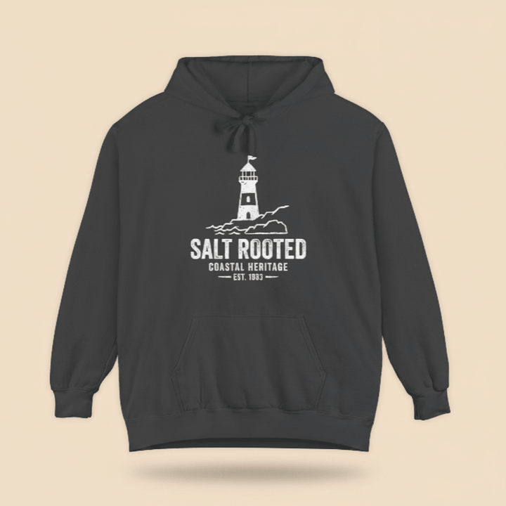 Pepper charcoal Salt Rooted lighthouse hoodie on sandy beige background — mobile product shot
