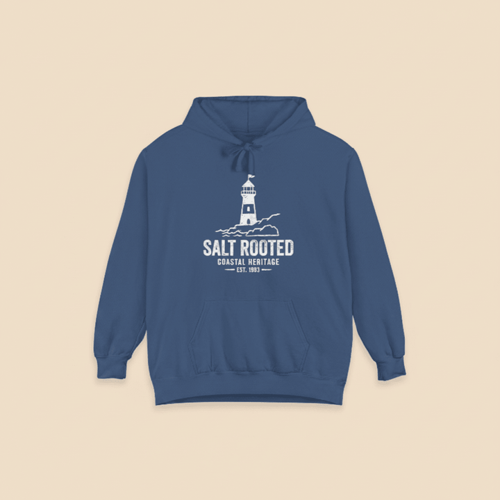 True Navy Salt Rooted lighthouse hoodie on sandy beige background — mobile product shot