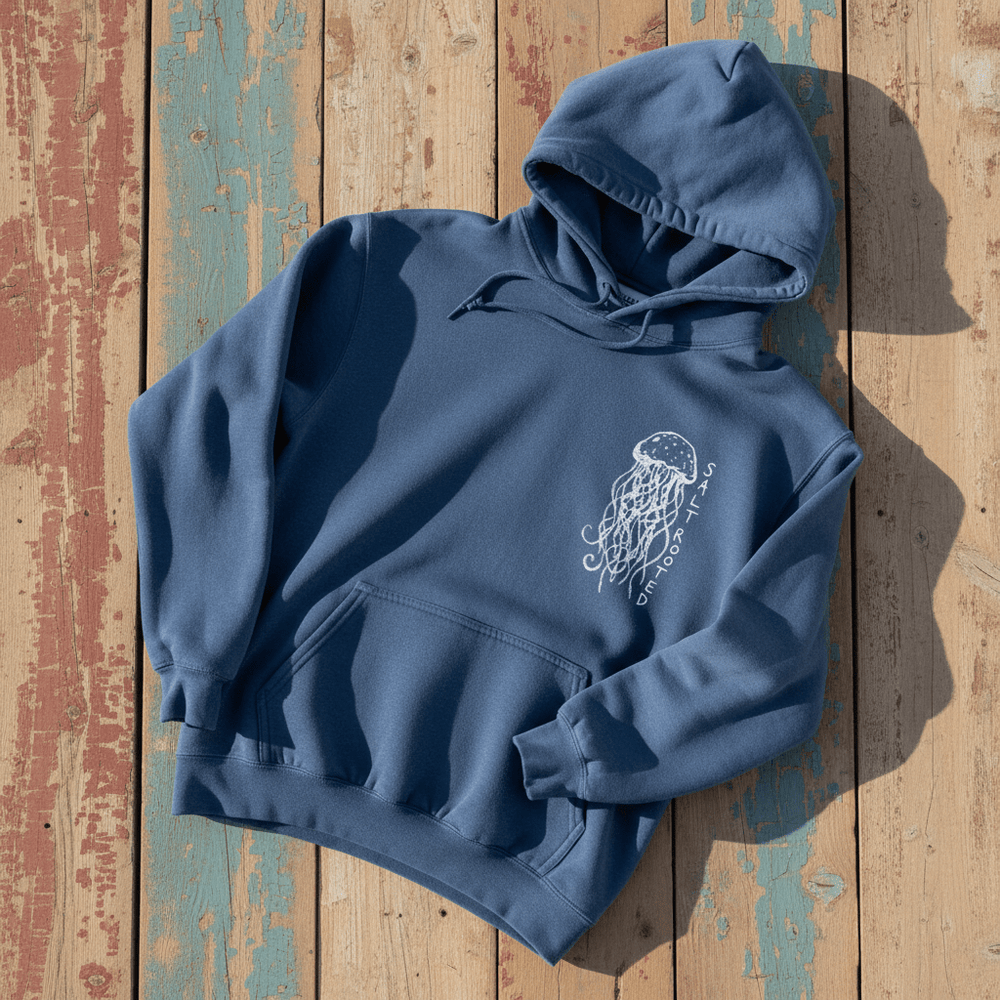 Salt Rooted Jellyfish Hoodie in Blue Jean — front chest graphic with hand-drawn jellyfish on driftwood