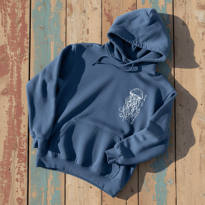 Salt Rooted Jellyfish Hoodie in Blue Jean — front chest graphic with hand-drawn jellyfish on driftwood