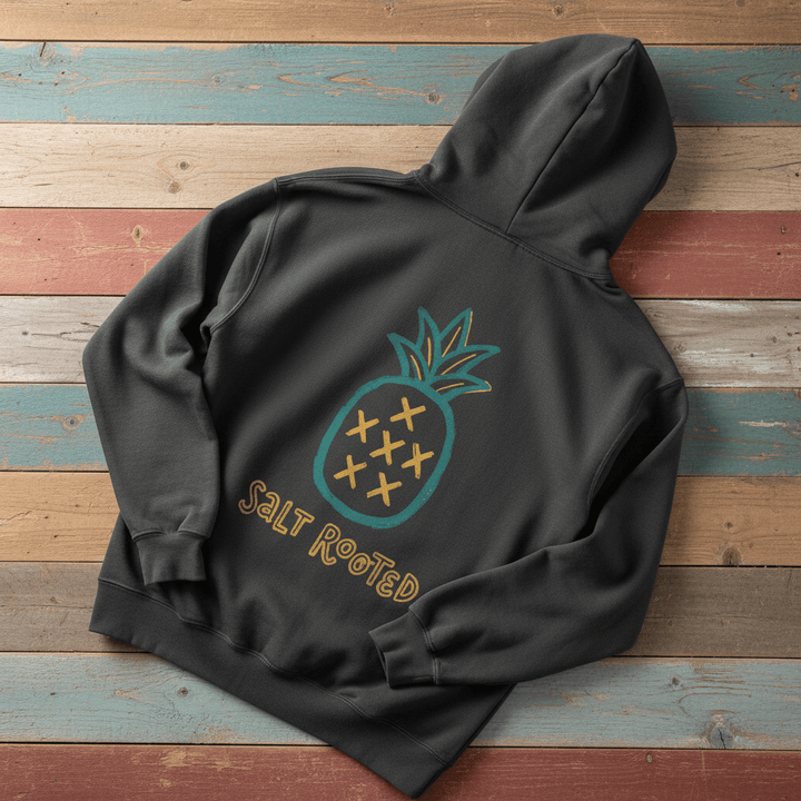 Salt Rooted Pineapple Hoodie in Pepper — back graphic with teal pineapple and SALT ROOTED lettering on driftwood