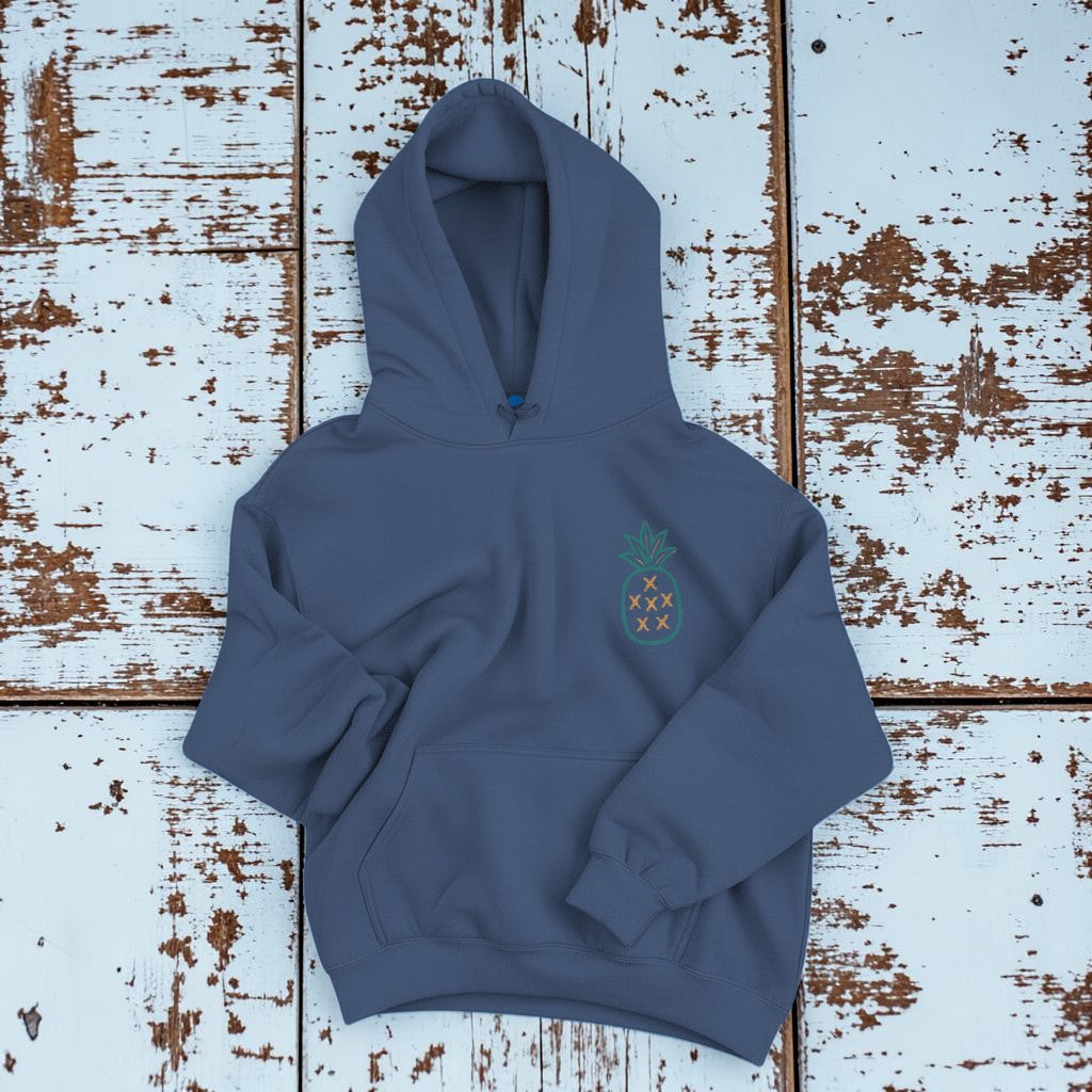 Salt Rooted Pineapple Hoodie in Steel Blue — front chest pineapple graphic on driftwood