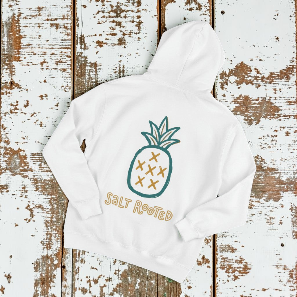 Salt Rooted Pineapple Hoodie in White — back graphic with teal pineapple and SALT ROOTED lettering on driftwood