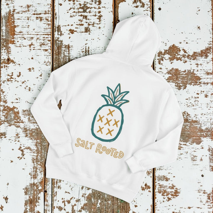 Salt Rooted Pineapple Hoodie in White — back graphic with teal pineapple and SALT ROOTED lettering on driftwood