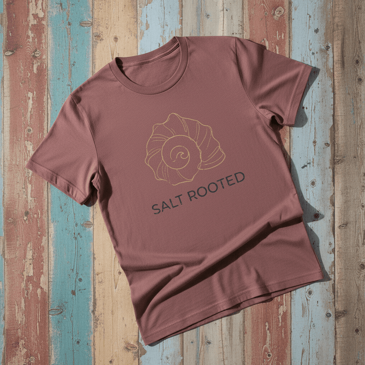 Flat lay - brick mauve Salt Rooted tee on weathered driftwood planks