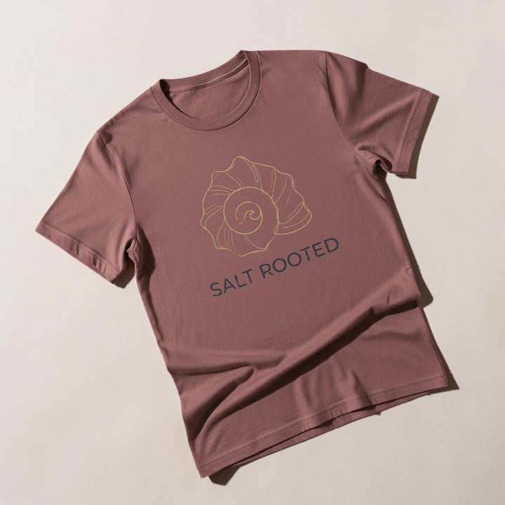 Flat lay - brick mauve Salt Rooted tee on weathered driftwood planks
