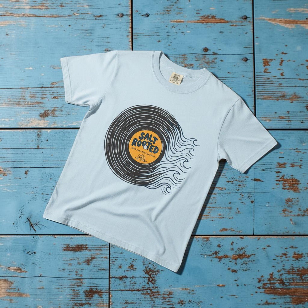 Salt Rooted Vinyl Record Tee in Chambray Blue — front graphic, warm sand studio background