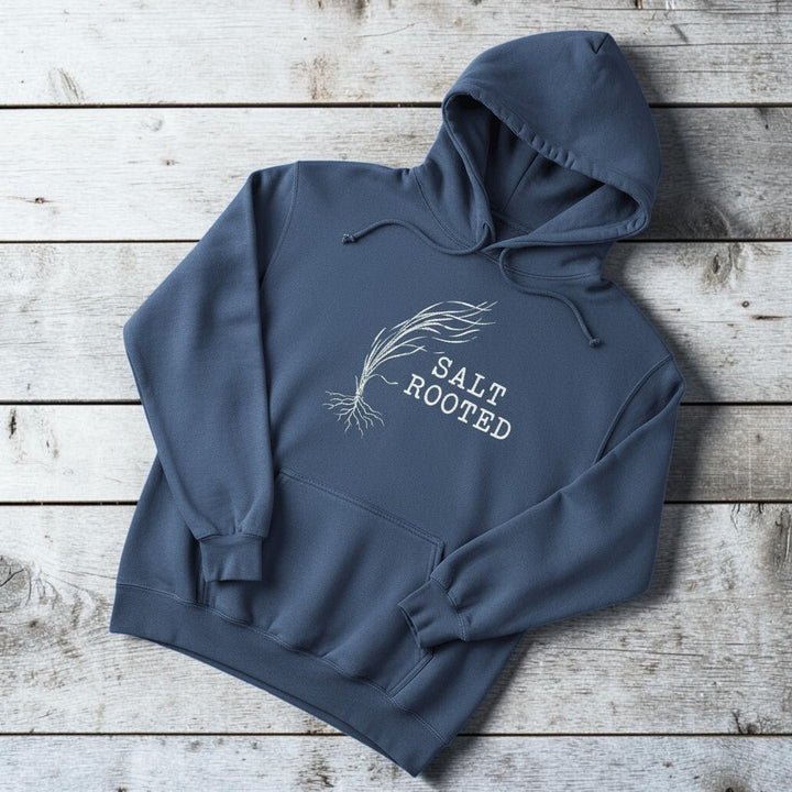 Salt Rooted Wheat Hoodie in Denim — front sea grass graphic and SALT ROOTED text on driftwood