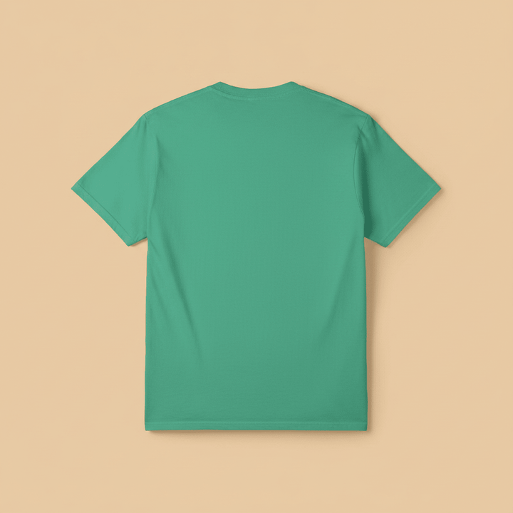 Saltwater Surf Club Tee in Island Green — plain back, warm sand studio background