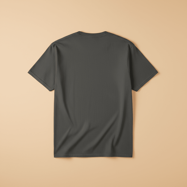 Saltwater Surf Club Tee in Pepper/Charcoal — plain back, warm sand studio background