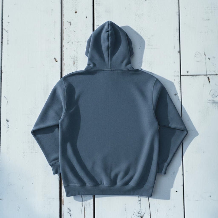 Saltwater Surf Club Hoodie in Denim — plain back, warm sand studio background