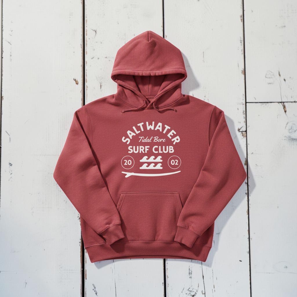 Saltwater Surf Club Hoodie in Crimson — front graphic, warm sand studio background