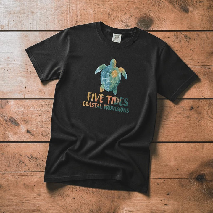Sea Turtle Coastal black garment-dyed tee casually tousled on rustic reclaimed wood
