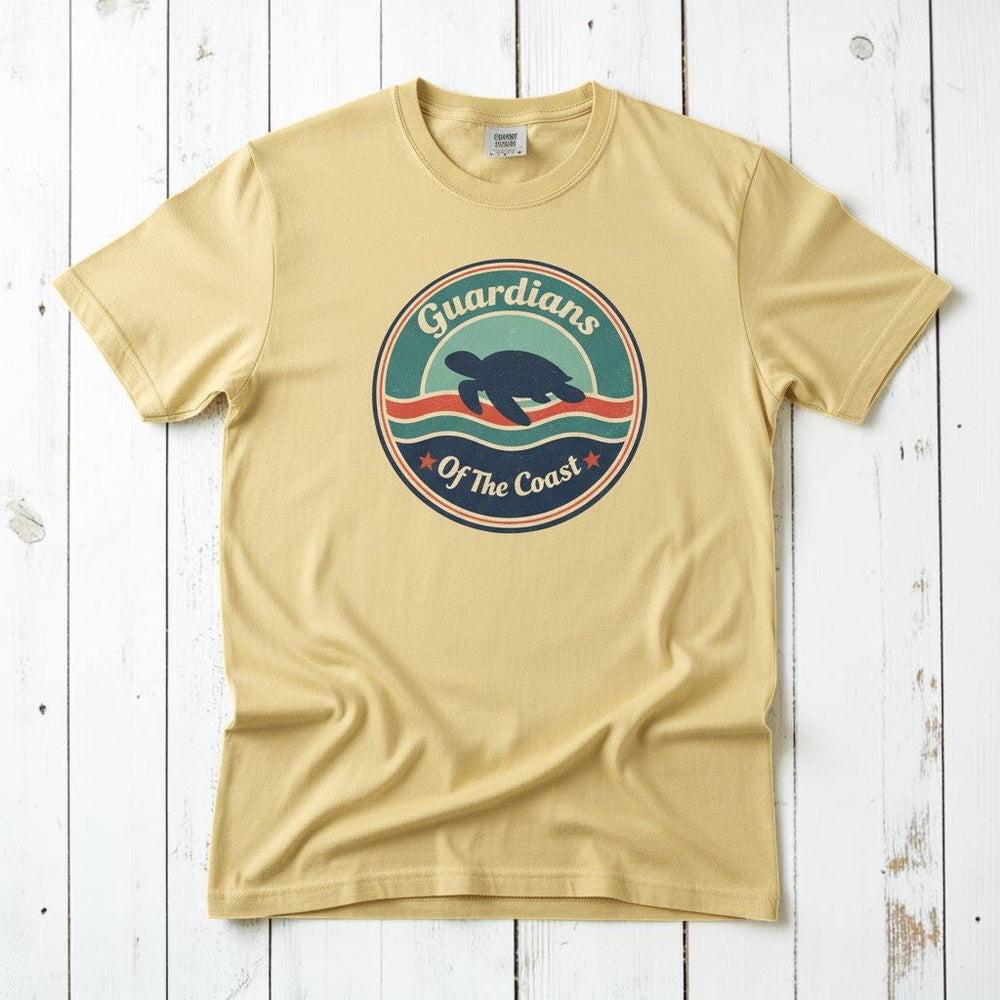 Sea Turtle Guardians of the Coast banana garment-dyed tee on faded driftwood planks