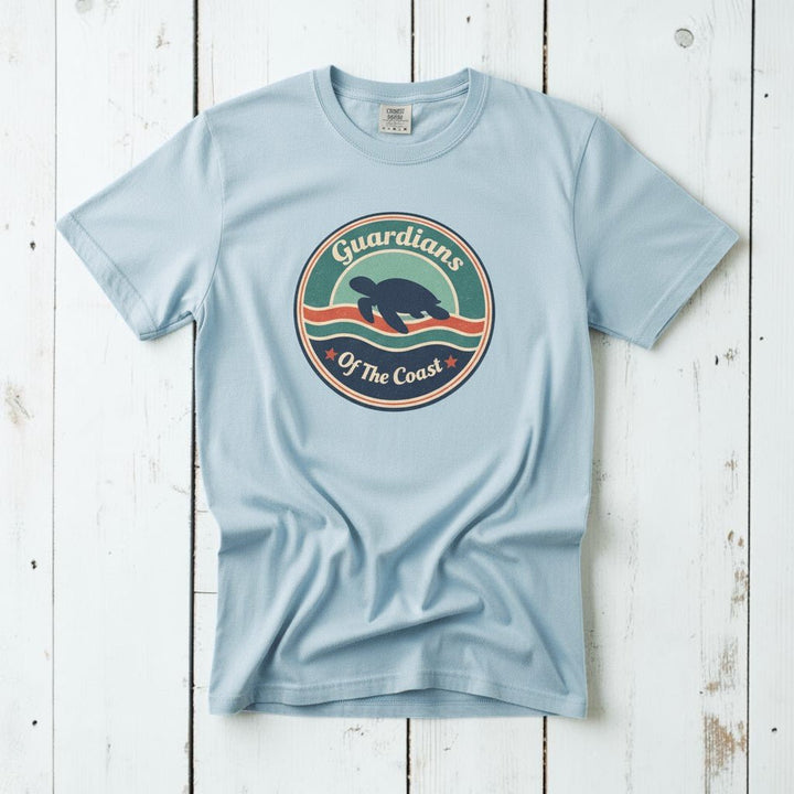 Sea Turtle Guardians of the Coast chambray garment-dyed tee on faded driftwood planks