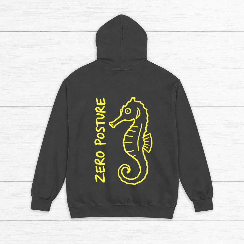 Pepper hoodie back with neon-yellow ZERO POSTURE lettering and matching seahorse art, on whitewashed boards.