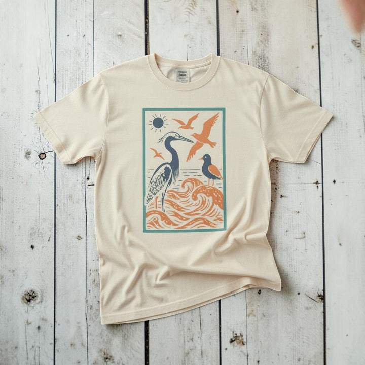 Serene Coastal Nature Scene ivory garment-dyed tee tossed on retro-grunge driftwood planks