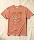 FIVE TIDES APPAREL terracotta garment-dyed cotton t-shirt featuring a coastal skull graphic with rope and sea blooms.