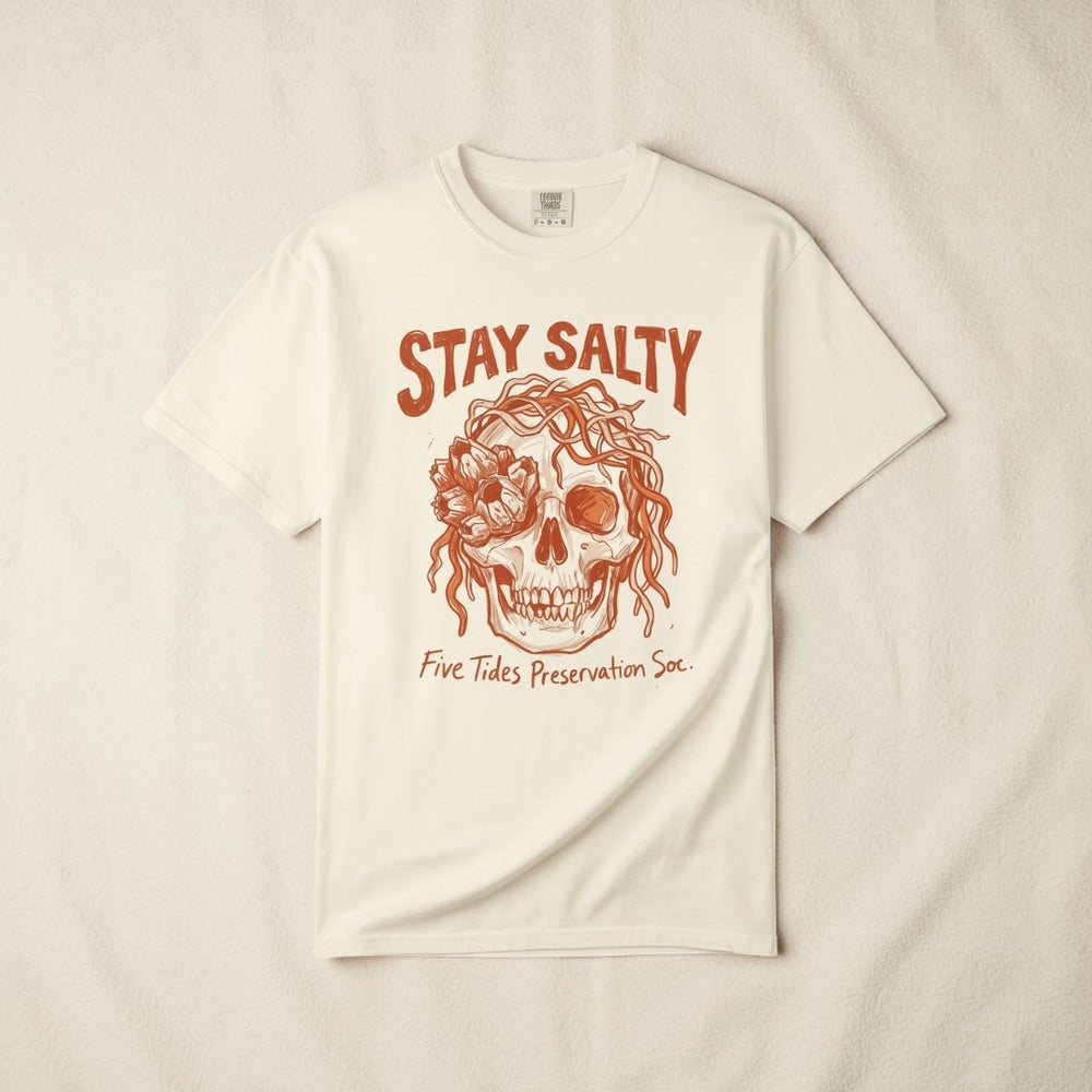 FIVE TIDES APPAREL ivory cotton t-shirt featuring a sun-faded terracotta skull graphic with rope and sea blooms.