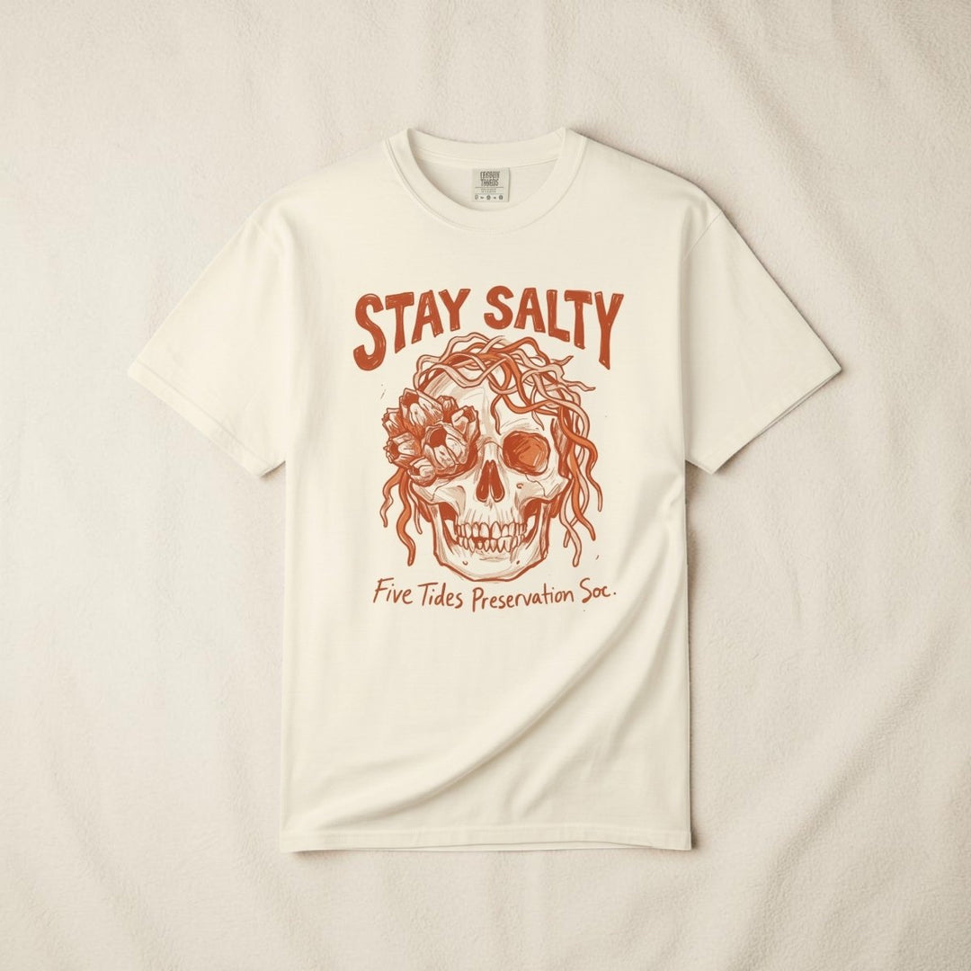 FIVE TIDES APPAREL ivory cotton t-shirt featuring a sun-faded terracotta skull graphic with rope and sea blooms.