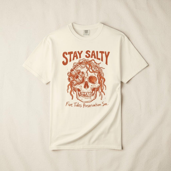 FIVE TIDES APPAREL ivory cotton t-shirt featuring a sun-faded terracotta skull graphic with rope and sea blooms.