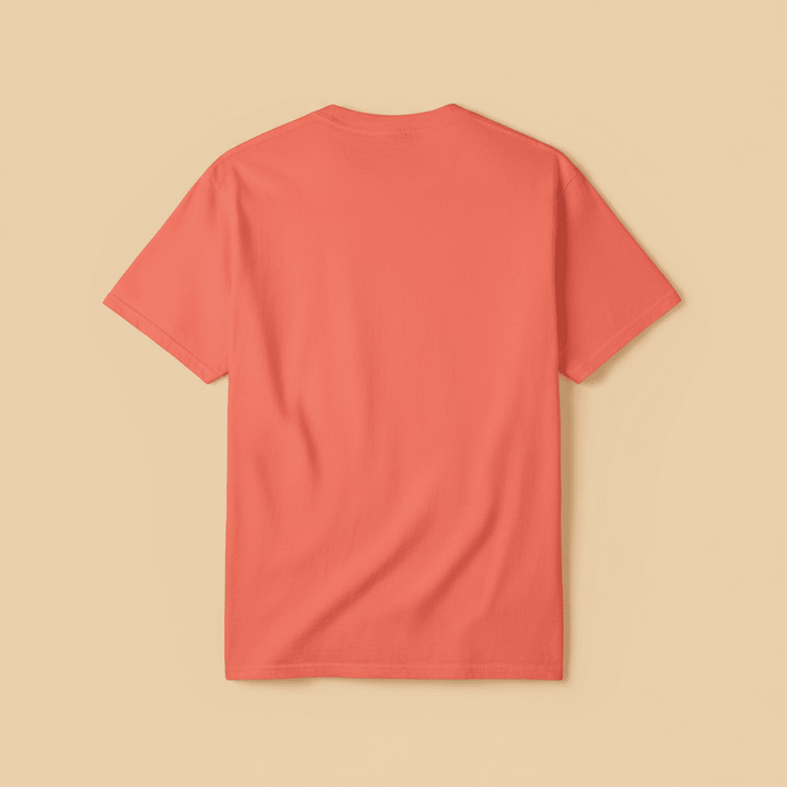 Surf Club Tee in Bright Salmon — plain back, warm sand studio background