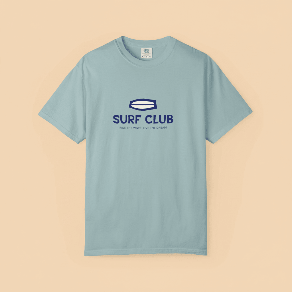 Surf Club Tee in Bay — front graphic, warm sand studio background