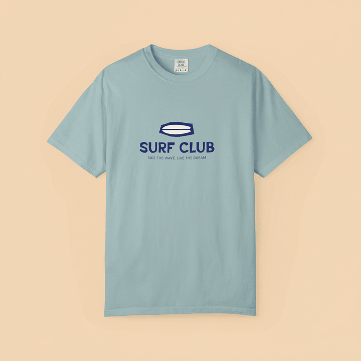 Surf Club Tee in Bay — front graphic, warm sand studio background