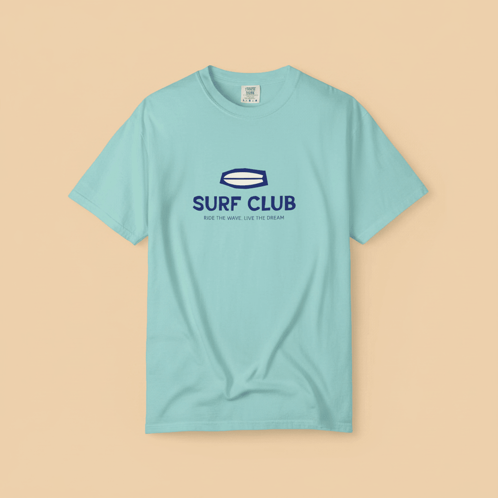 Surf Club Tee in Chalky Mint — front graphic, warm sand studio background