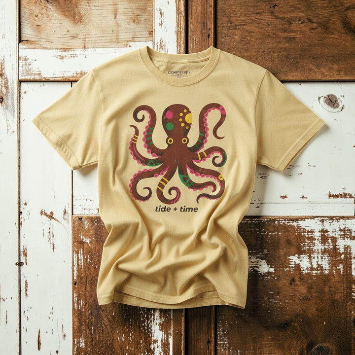 Tide + Time Octopus banana garment-dyed tee casually tousled on rustic reclaimed wood