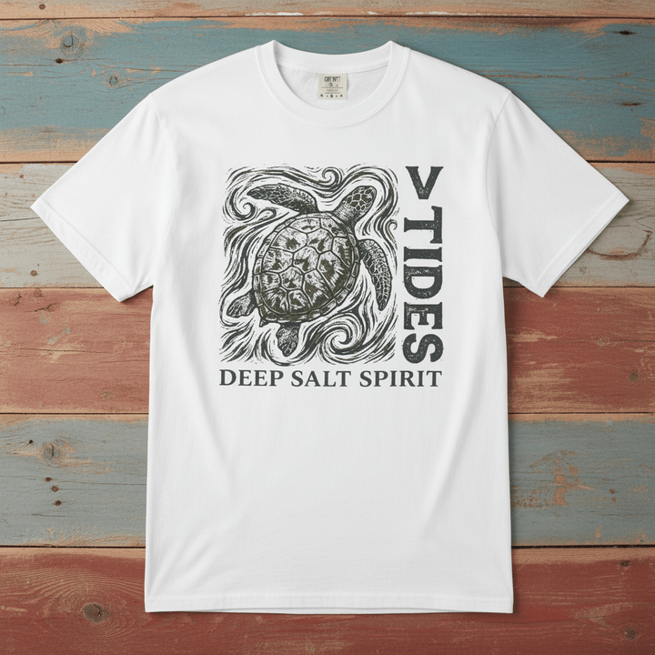 Flat lay - white V Tides Deep Salt Spirit tee on weathered driftwood planks