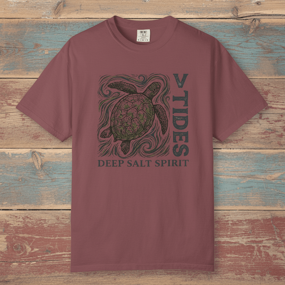 Flat lay - mauve V Tides Deep Salt Spirit tee on weathered driftwood planks