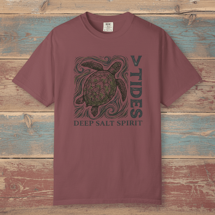 Flat lay - mauve V Tides Deep Salt Spirit tee on weathered driftwood planks