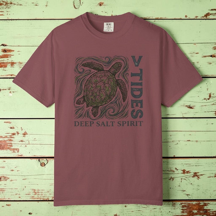 Flat lay - mauve V Tides Deep Salt Spirit tee on weathered driftwood planks