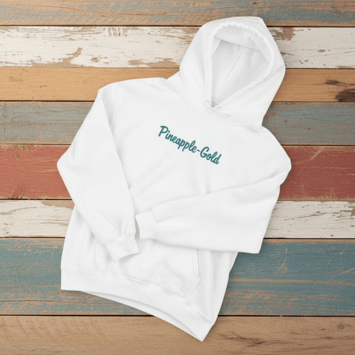 Pineapple-Gold Hoodie in White — front chest Pineapple-Gold script graphic on driftwood