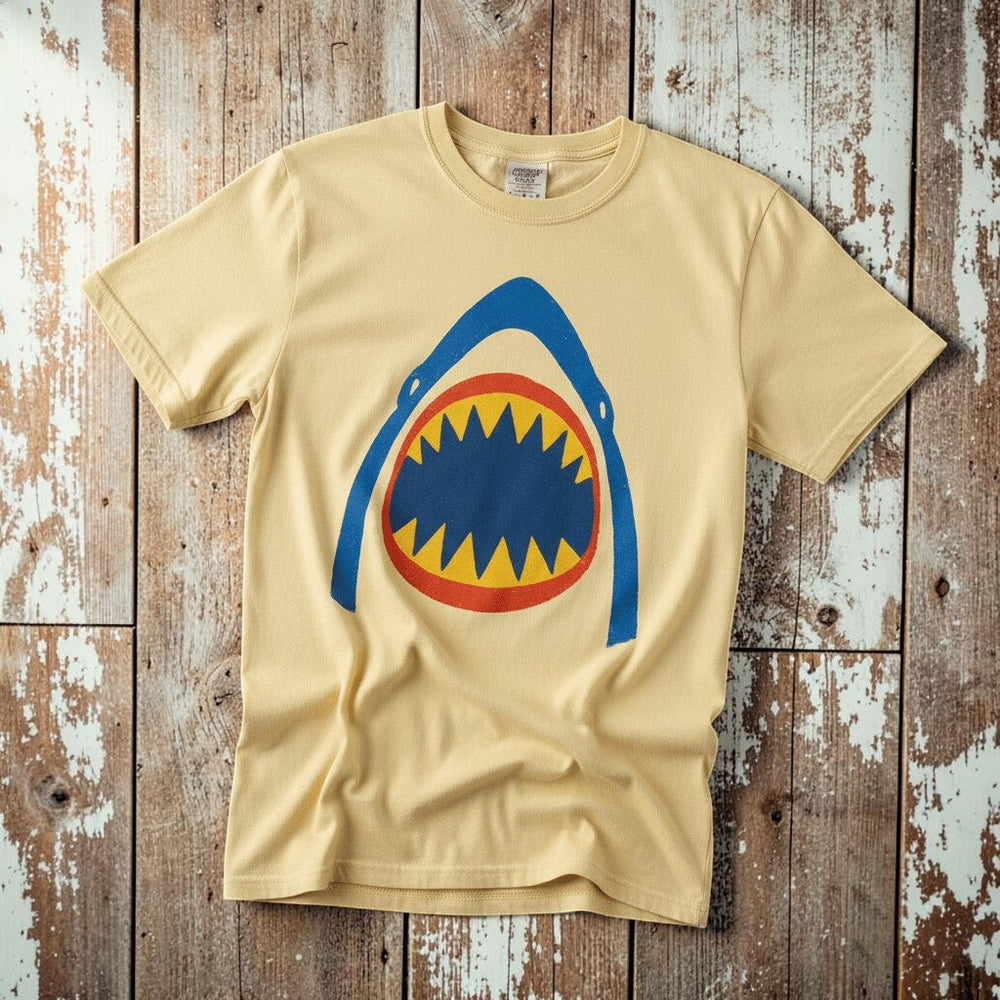 Vintage Surf Shark banana garment-dyed tee on faded driftwood planks
