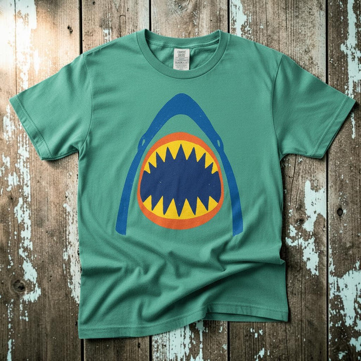 Vintage Surf Shark island green garment-dyed tee on faded driftwood planks
