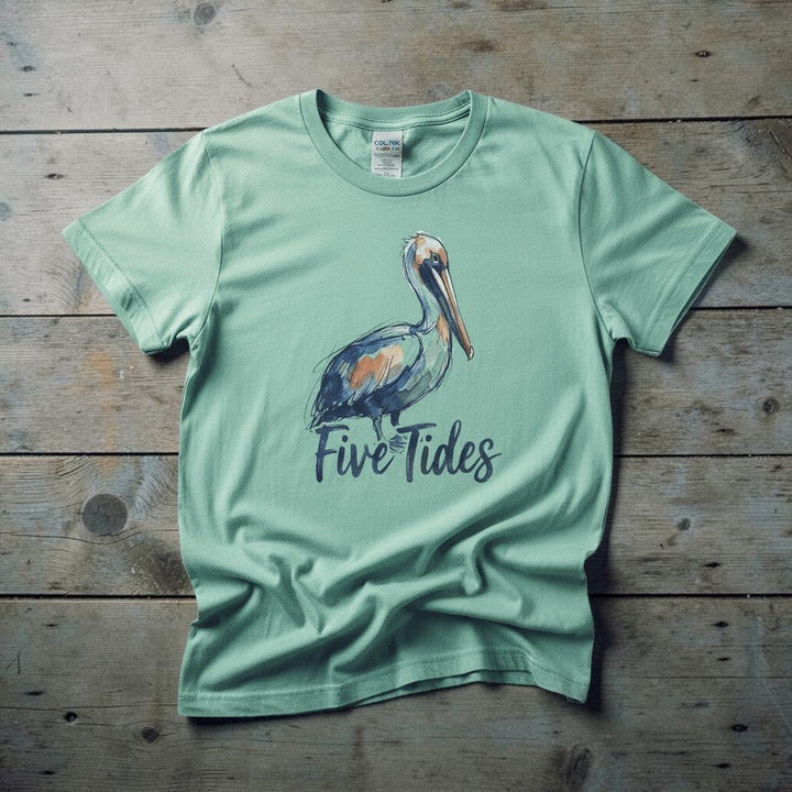 Watercolor Pelican island reef garment-dyed tee casually tousled on rustic reclaimed wood