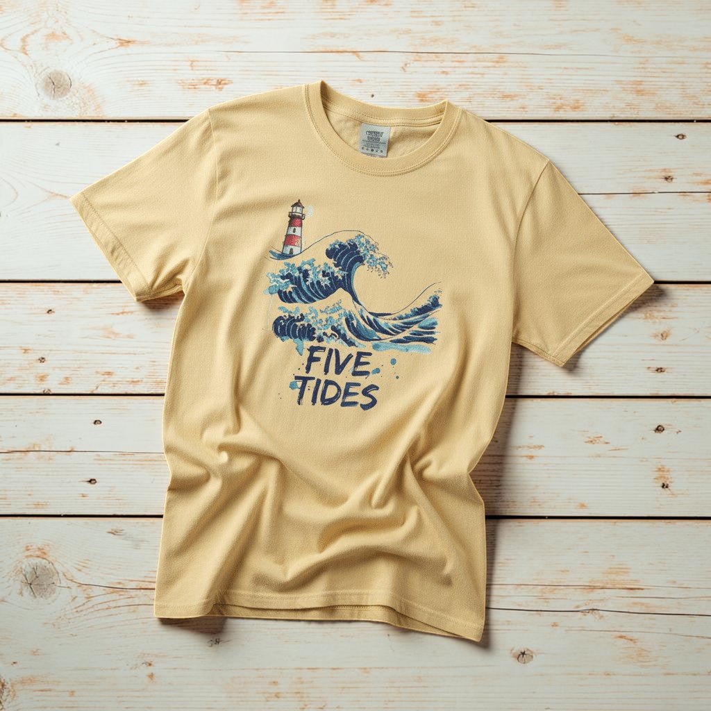 Wave &amp; Lighthouse banana garment-dyed tee casually tousled on rustic reclaimed wood