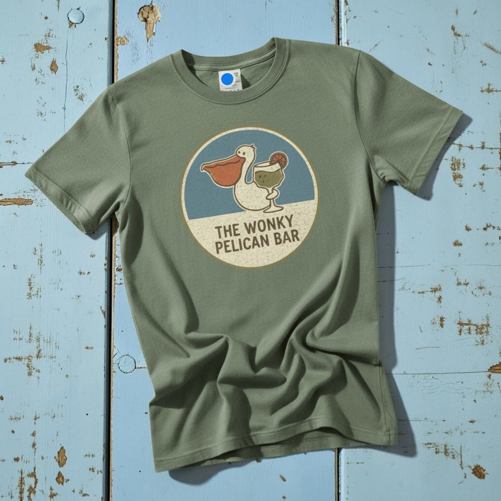 Flatlay - sage green Wonky Pelican Bar tee on driftwood