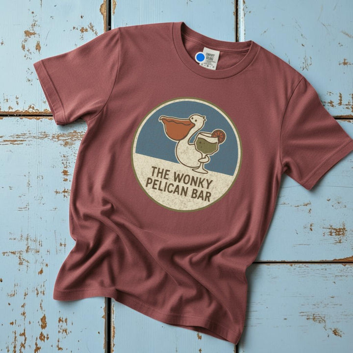 Flatlay - dusty rose Wonky Pelican Bar tee on driftwood